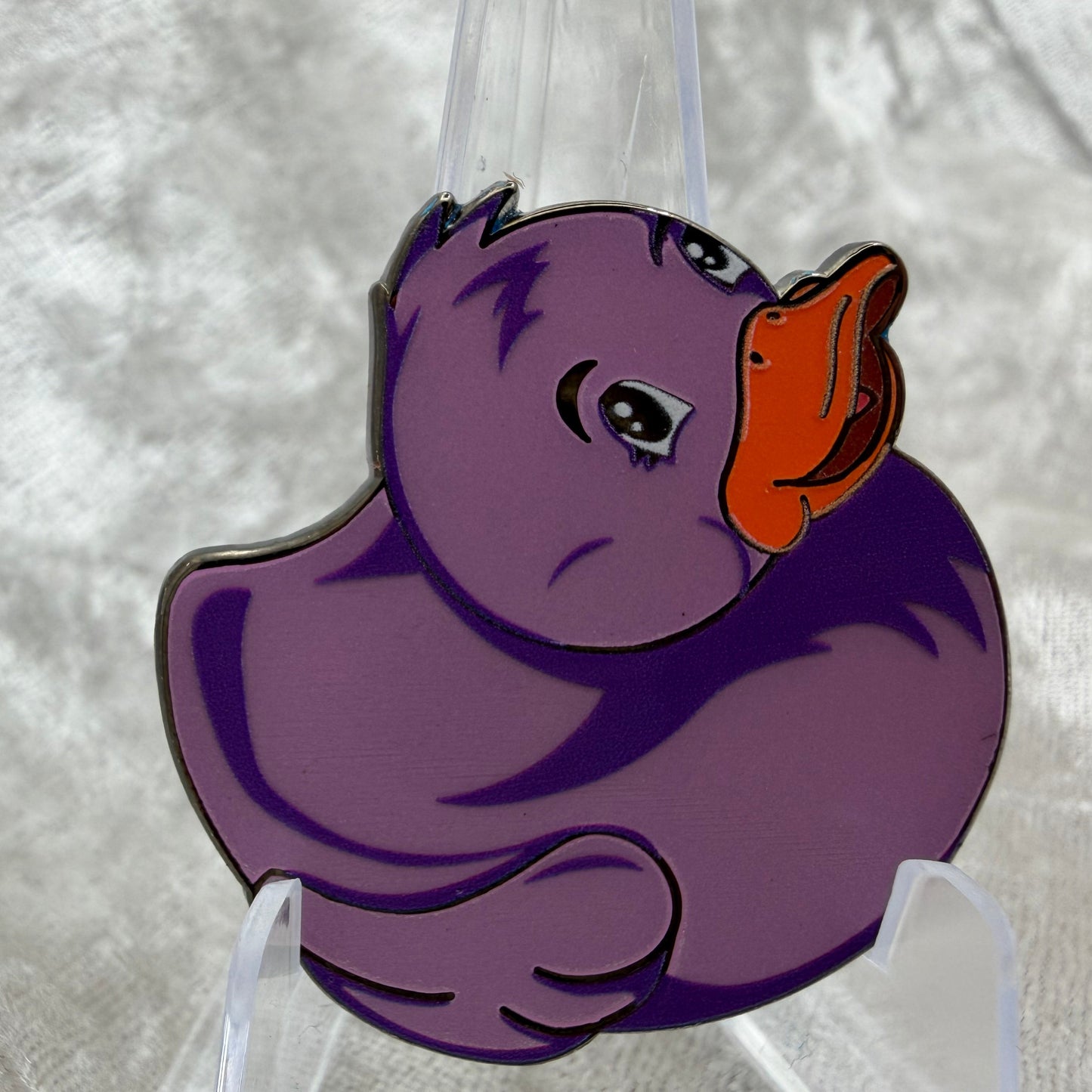 1.5 inch purple glow in the dark duck enamel pin by Bendiesticks, limited edition of 30.