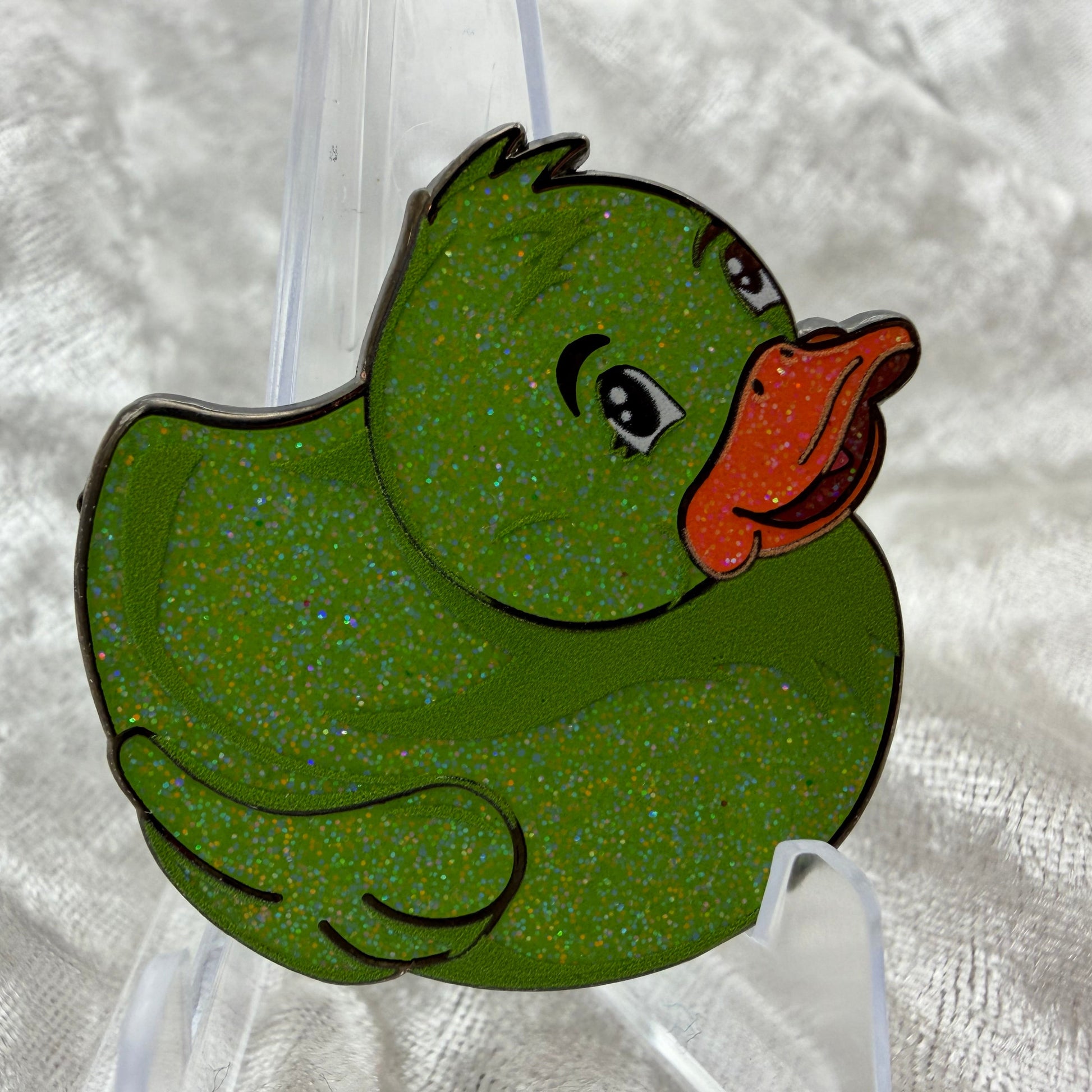 1.5 inch green glitter duck enamel pin designed by Bendiesticks, ultra limited edition of 10.