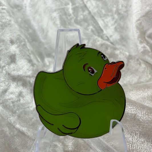 
1.5 inch green glow in the dark duck enamel pin designed by Bendiesticks, limited edition of 30.