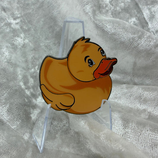 1.5 inch orange glow in the dark duck enamel pin by Bendiesticks, limited edition of 30.
