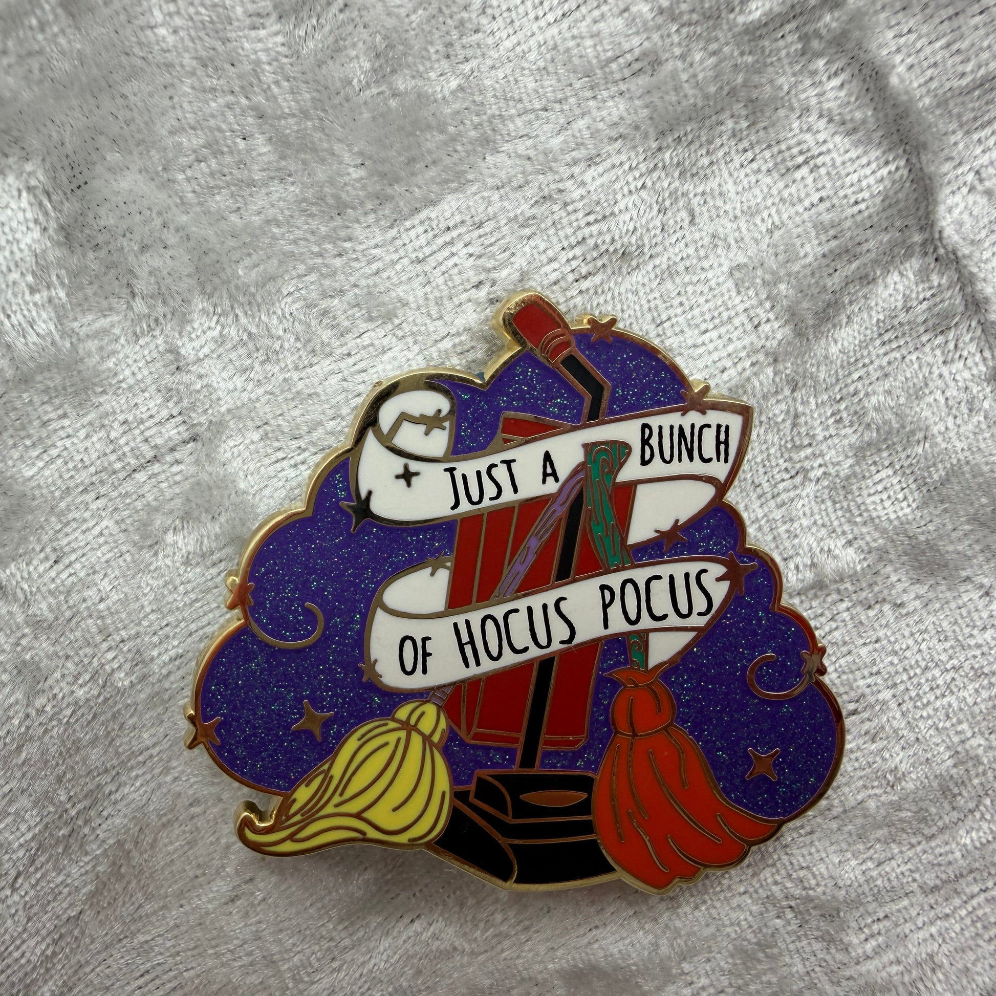 2 inch Hocus Pocus Sanderson Sisters glitter enamel pin with gold metal finish designed by Unicorn Crafts.