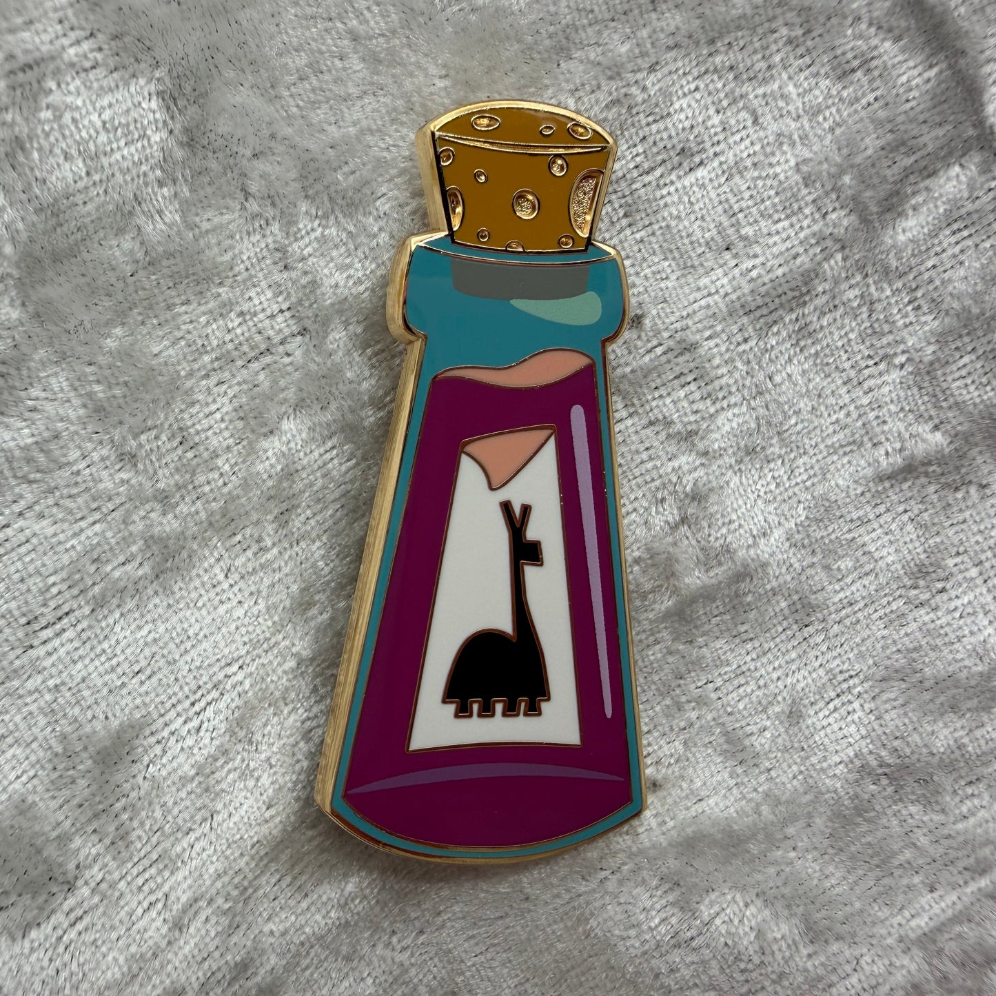 2 inch glow in the dark llama potion bottle enamel pin designed by Unicorn Crafts.