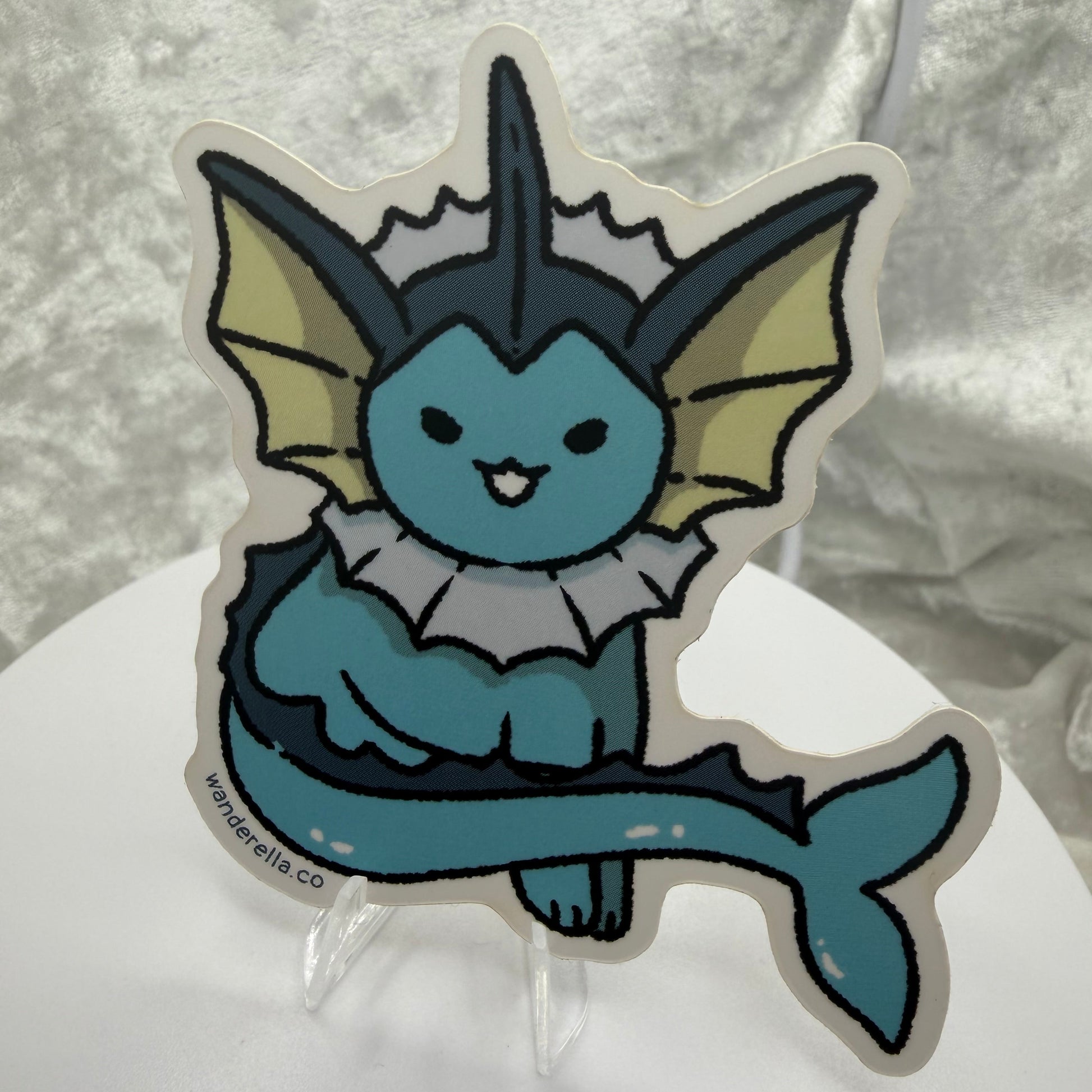  A 3-inch water elemental fox vinyl sticker with a solid white border on a laptop cover.