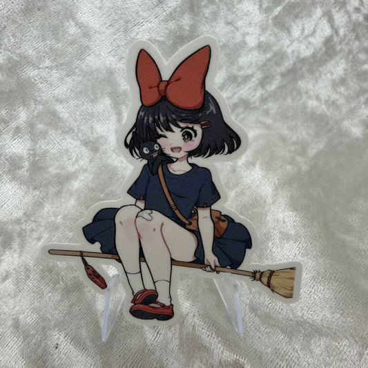A vinyl sticker of Kiki from the Studio Girls collection with a textured sand glitter sparkle laminate finish on a white background.