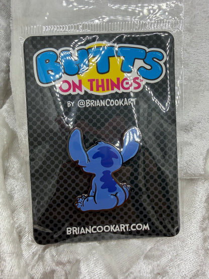 Blue Alien Experiment Butt Pin by Brian Cook funny blue space alien parody enamel pin on backing card
