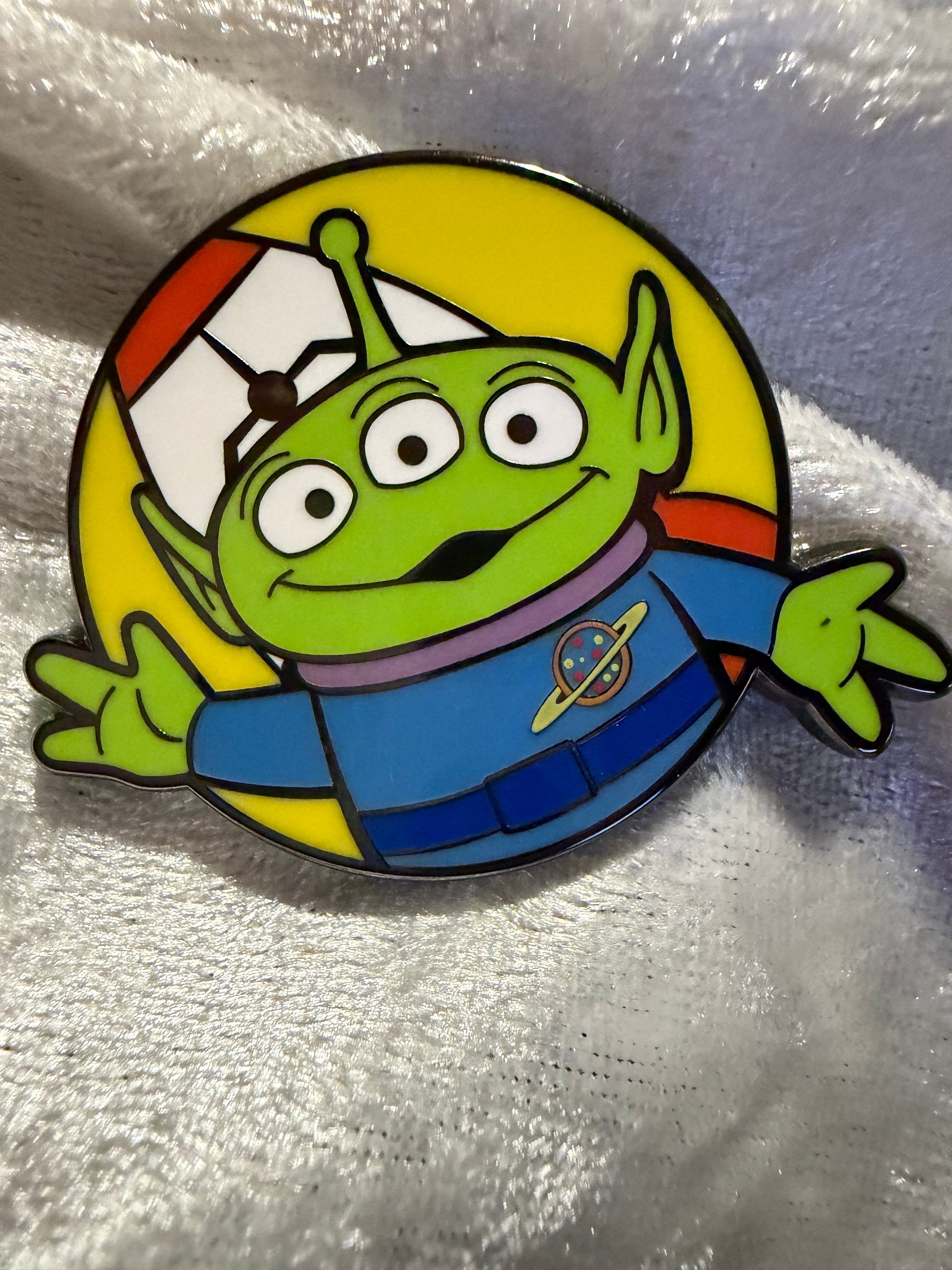 Close-up of Alien FiGPiN Mini #Y1056 from Toy Story, officially licensed enamel pin