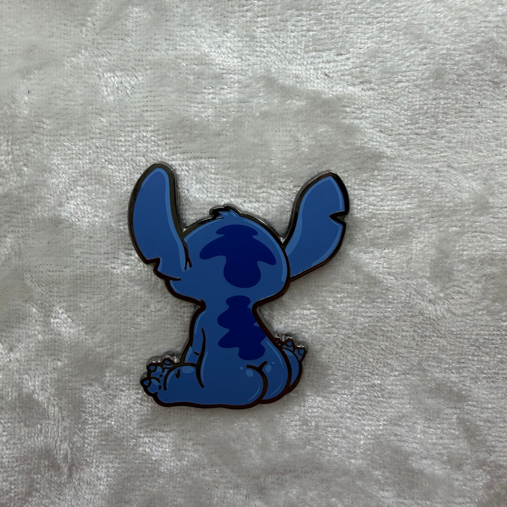 Close-up of Blue Alien Experiment Butt Pin by Brian Cook, hilarious 1.25 inch cartoon parody lapel pin