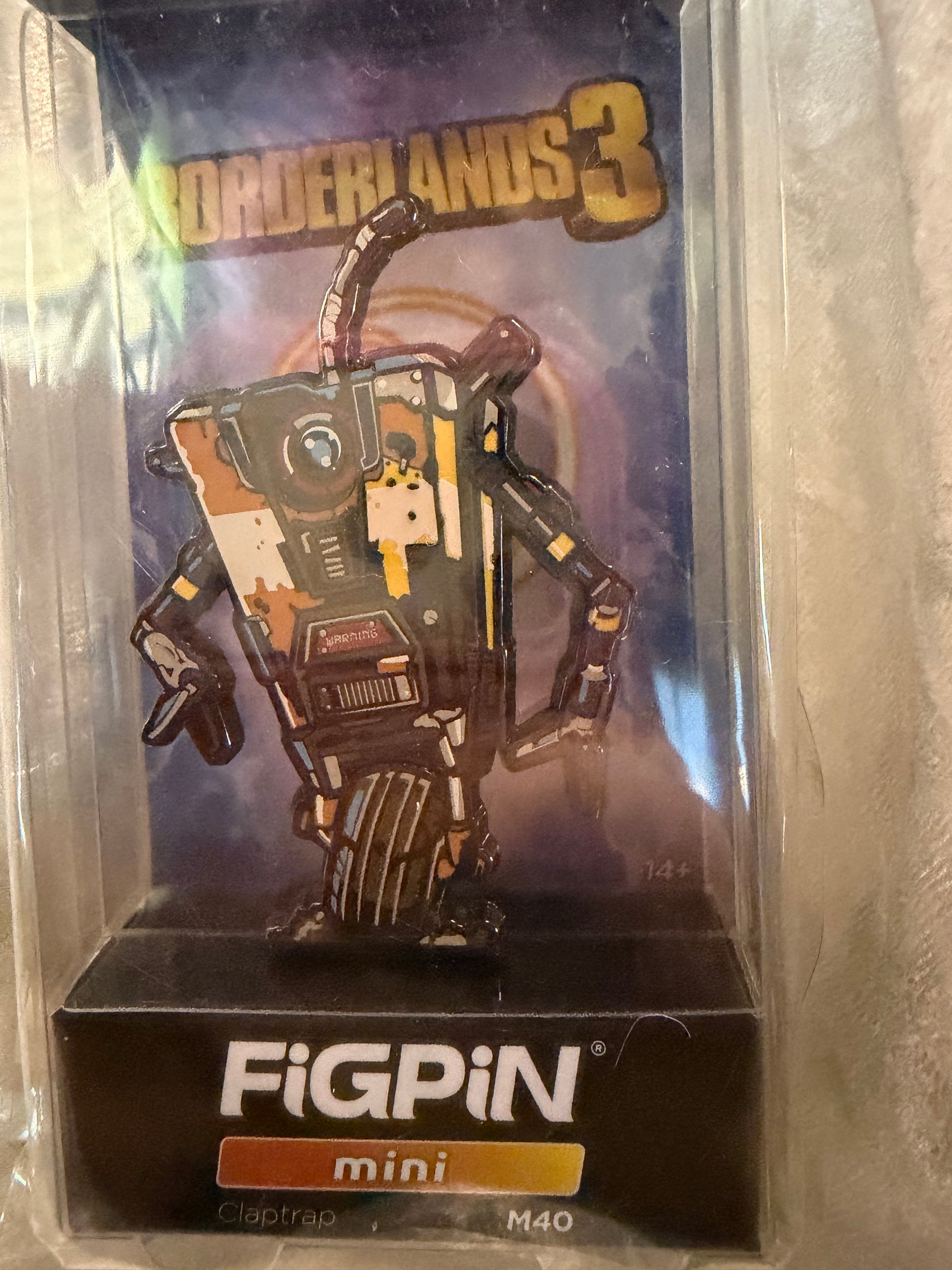 Close-up of Borderlands 3 Claptrap FiGPiN Mini #M40, officially licensed gaming collectible