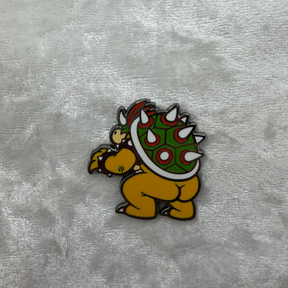 Close-up of Bowsie Butt Pin by Brian Cook, hilarious 1.25 inch gaming boss parody lapel pin