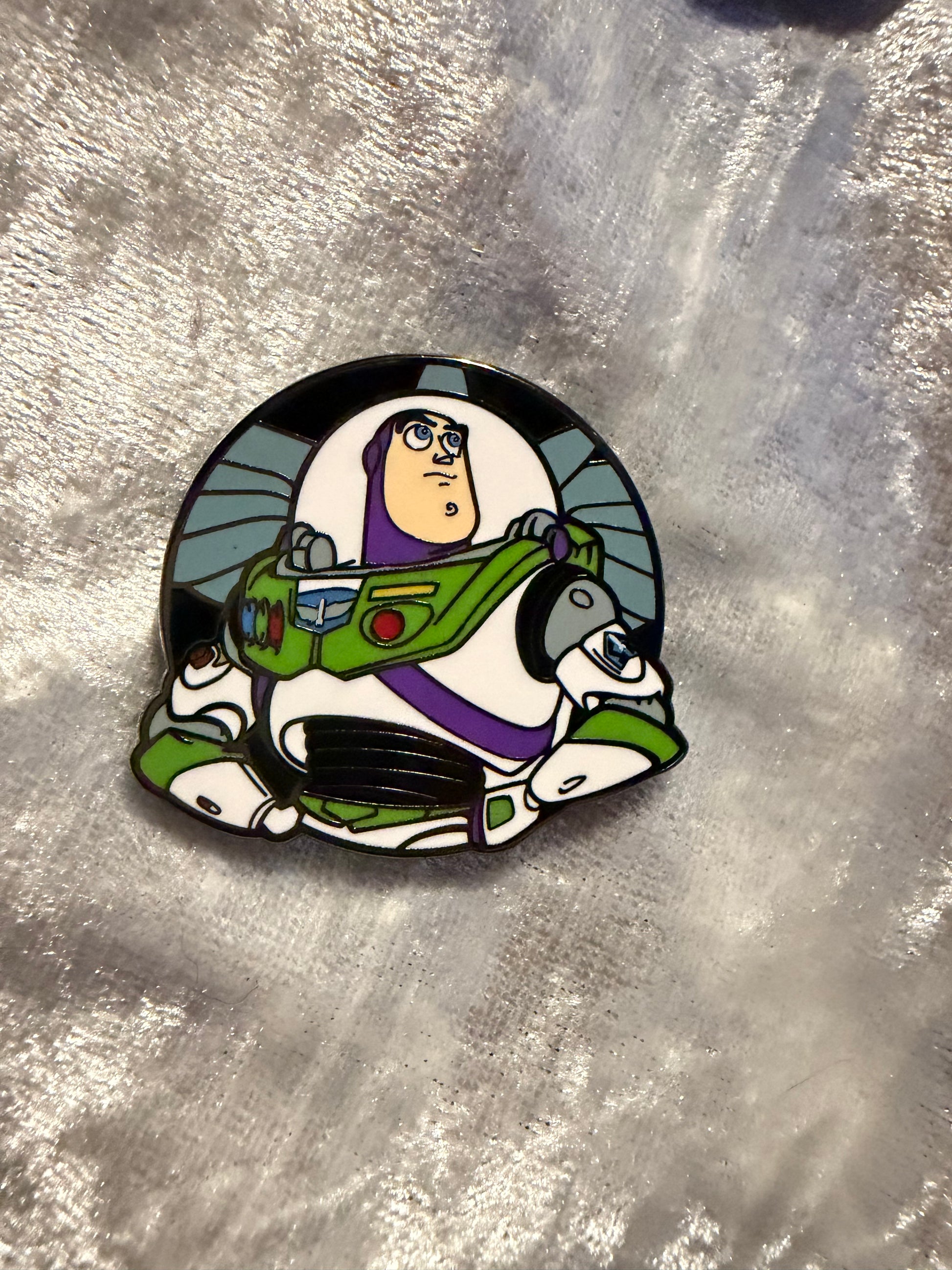 Close-up of Buzz Lightyear FiGPiN Mini #Y1054 from Toy Story, officially licensed enamel pin