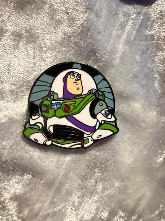 Close-up of Buzz Lightyear FiGPiN Mini #Y1054 from Toy Story, officially licensed enamel pin