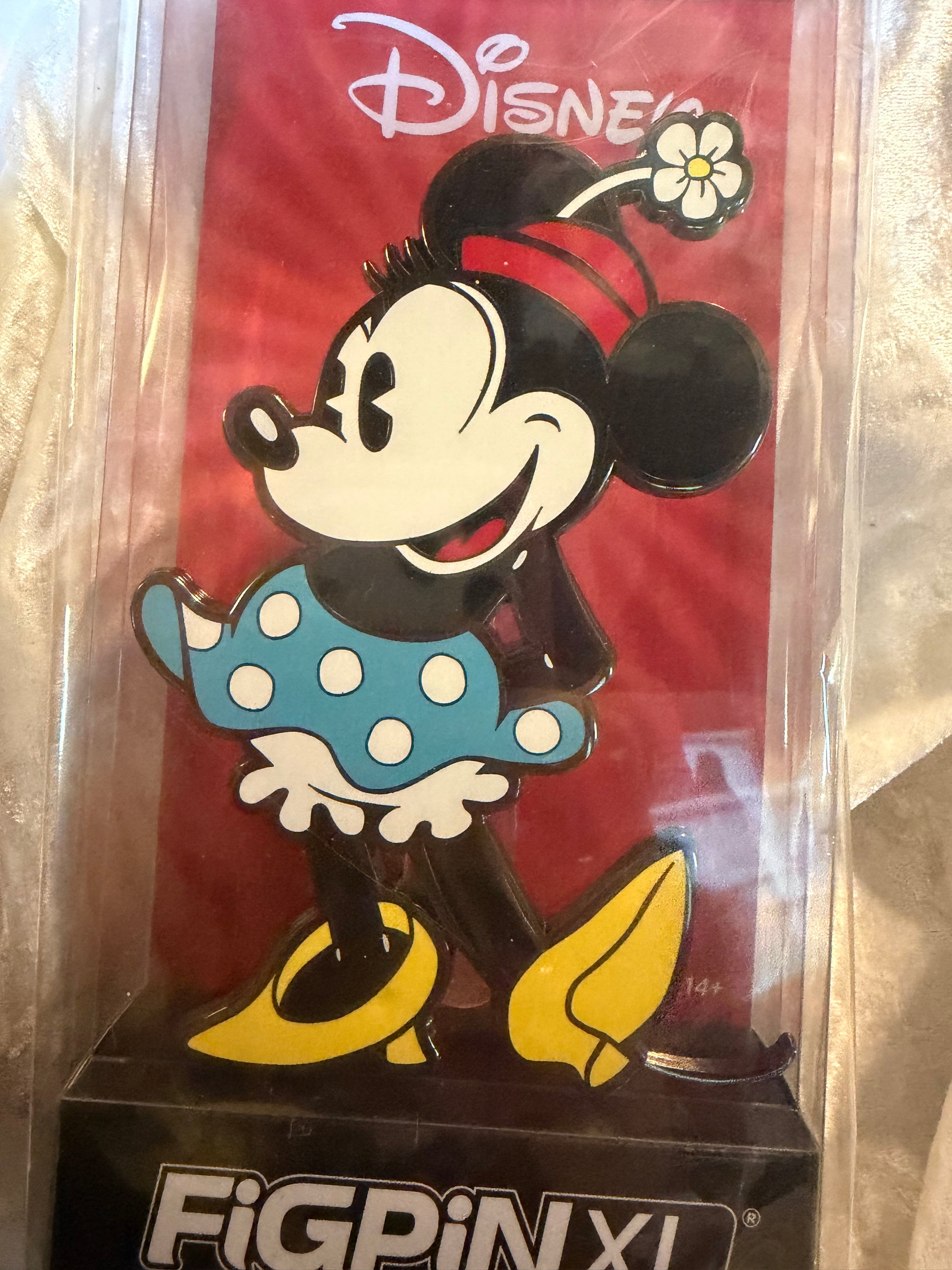 Close-up of Classic Disney Minnie Mouse FiGPiN XL #X33 in soft plastic display box, officially licensed collectible