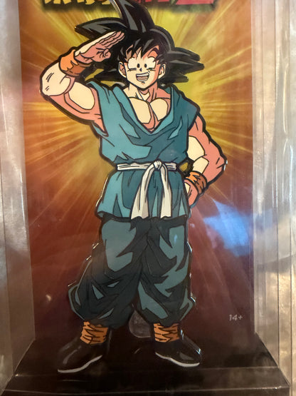 Close-up of Dragon Ball Z Casual Saluting Goku FiGPiN XL #X27 in soft plastic display box, officially licensed collectible