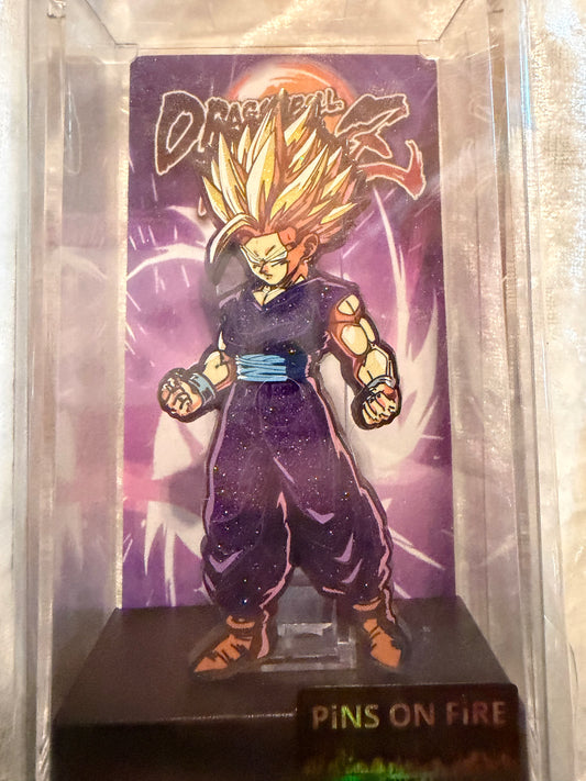 Close-up of Dragon Ball Z Gohan FiGPiN #385, officially licensed Pins On Fire Exclusive glitter enamel pin