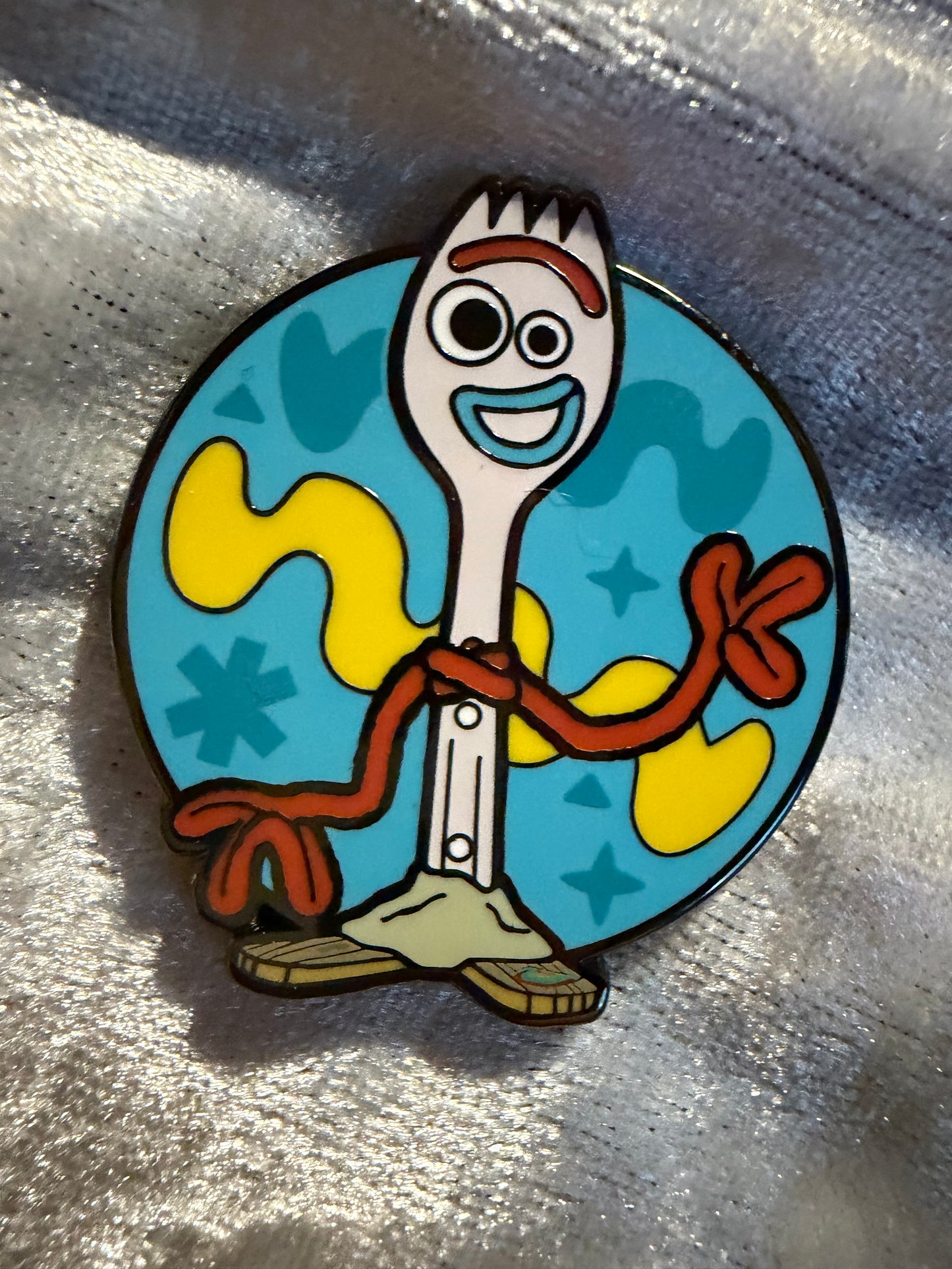 Close-up of Forky FiGPiN Mini #Y1059 from Toy Story, officially licensed enamel pin