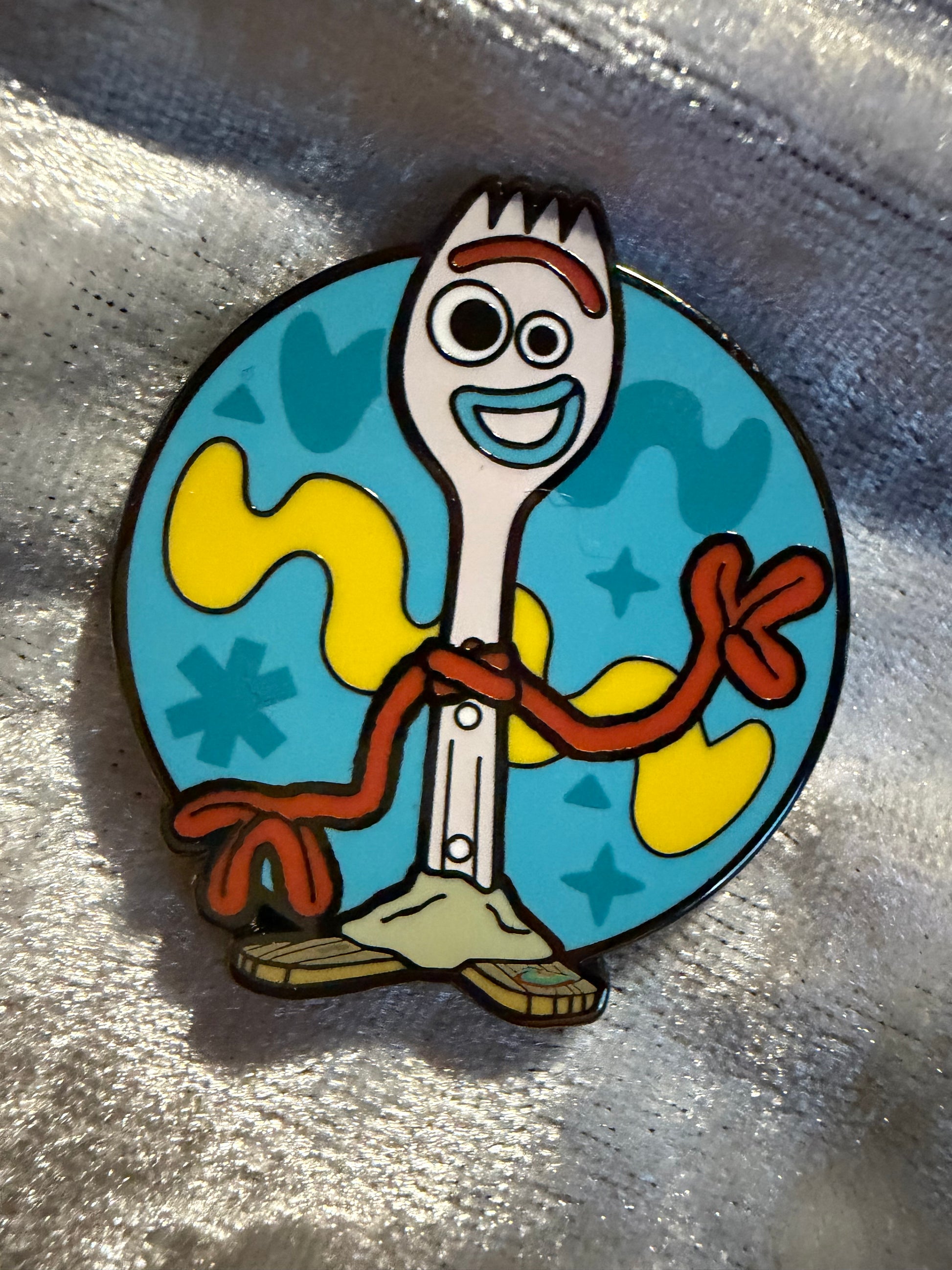 Close-up of Forky FiGPiN Mini #Y1059 from Toy Story, officially licensed enamel pin