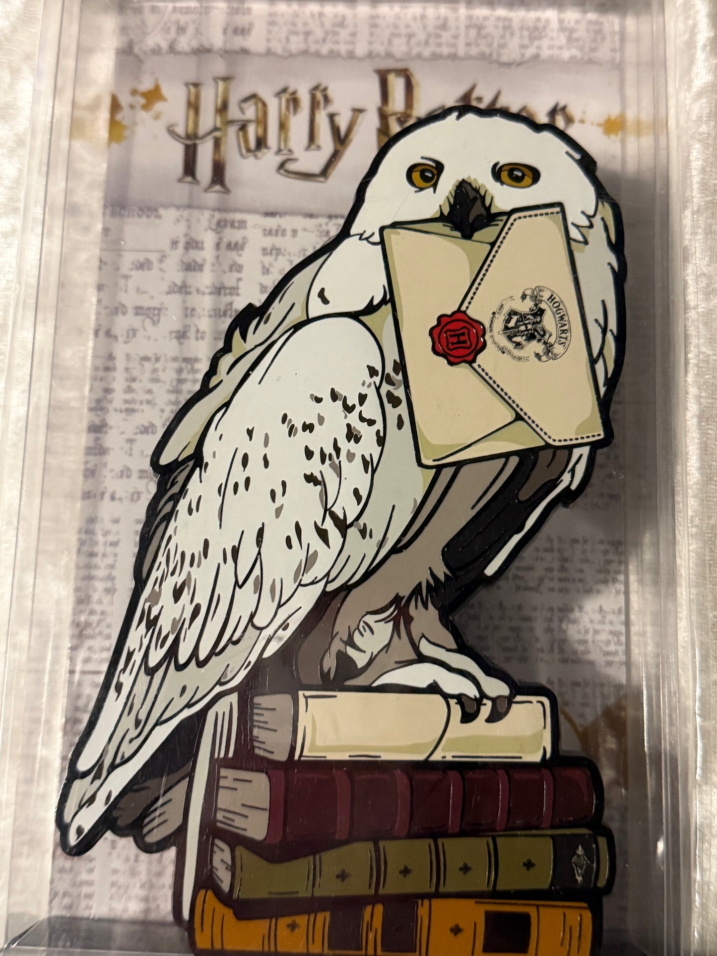 Close-up of Harry Potter Hedwig FiGPiN XL #X29 NYCC 2019 Exclusive in soft plastic display box, officially licensed collectible (The Orphanage)