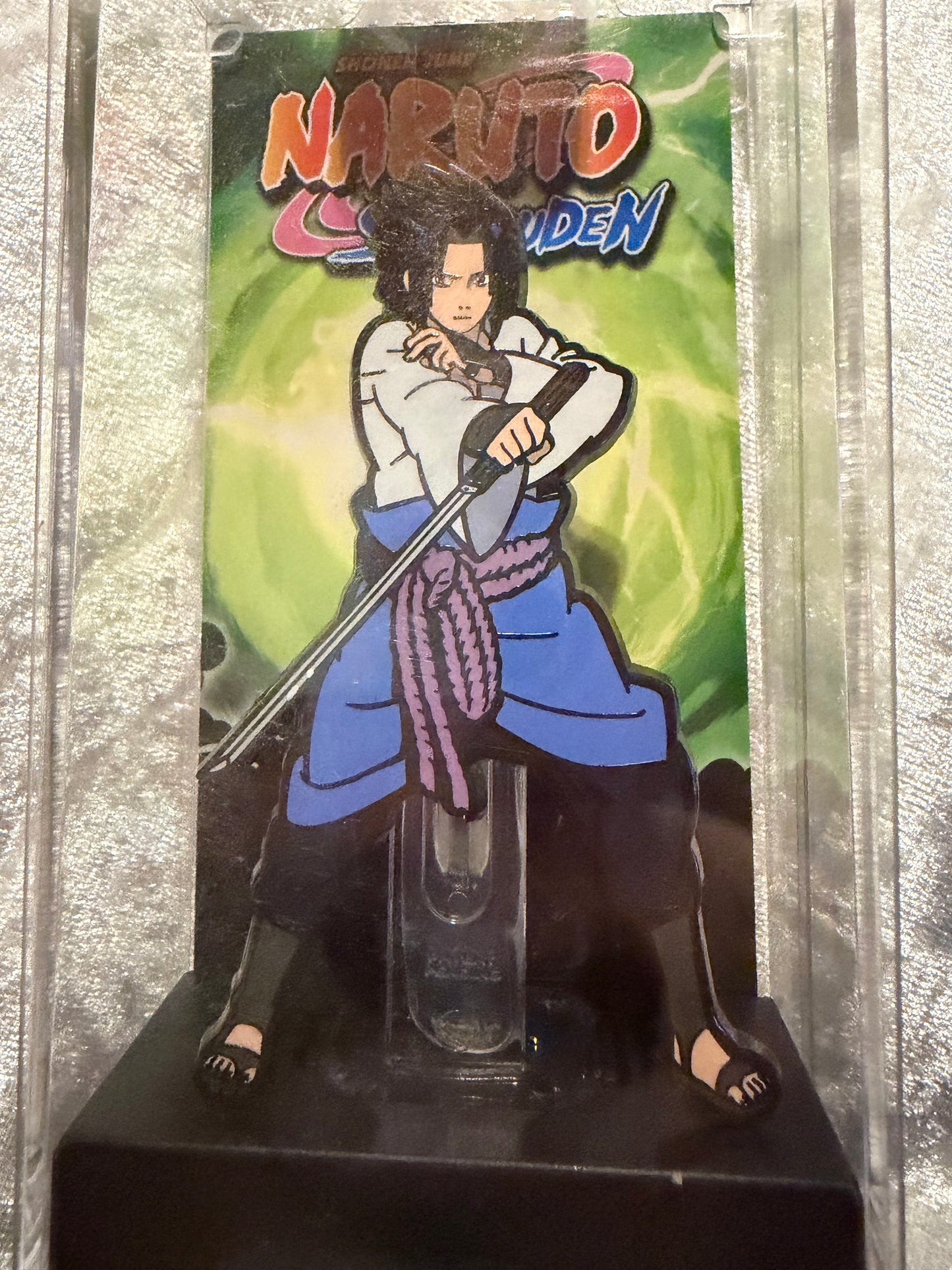Close-up of Naruto Sasuke Uchiha FiGPiN #92, officially licensed enamel pin (overall great condition)