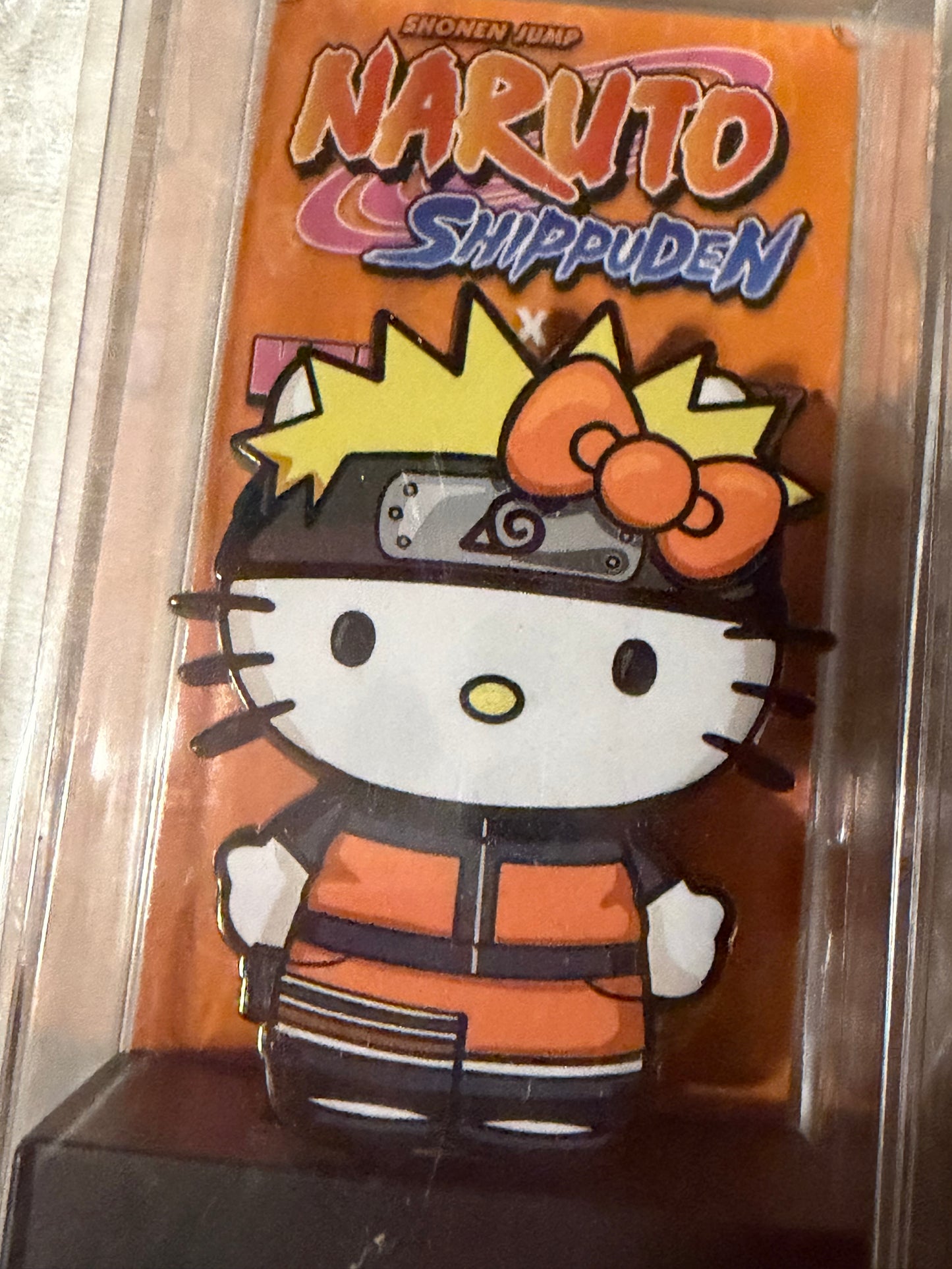 Close-up of Sanrio Hello Kitty as Naruto FiGPiN #635, officially licensed enamel pin