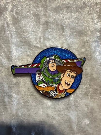 Close-up of Secret CHASE Glitter Woody & Buzz FiGPiN Mini (Y1063) from Toy Story (1/30 pull rate)