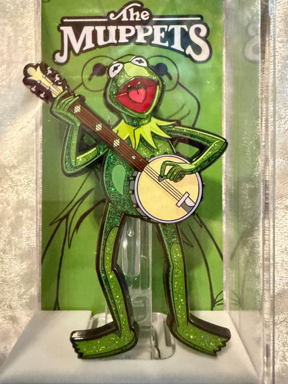 Close-up of The Muppets Kermit the Frog FiGPiN #2109 with vibrant green glitter, officially licensed Limited Edition enamel pin (looks brand new)
