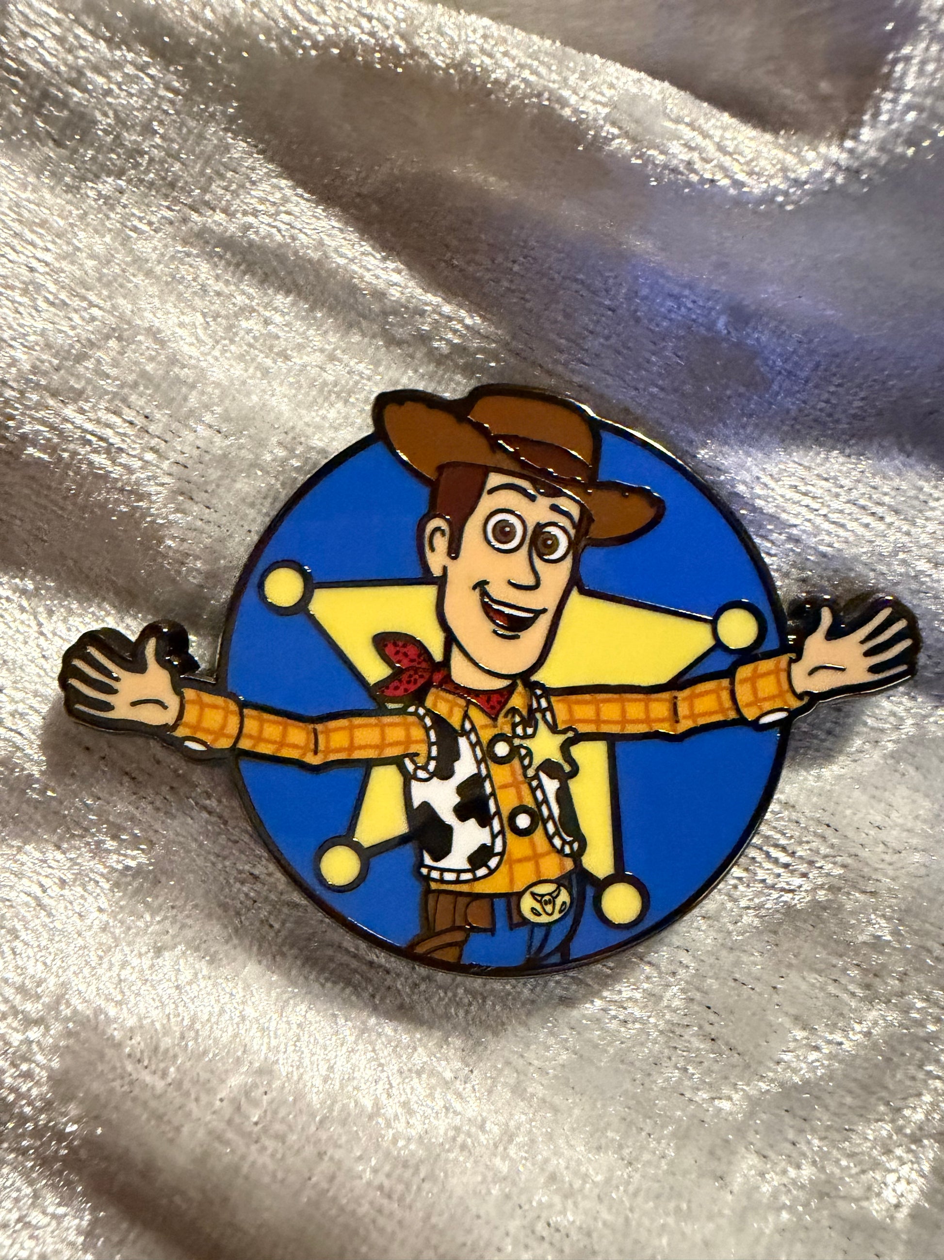 Close-up of Woody FiGPiN Mini #Y1053 from Toy Story, officially licensed enamel pin