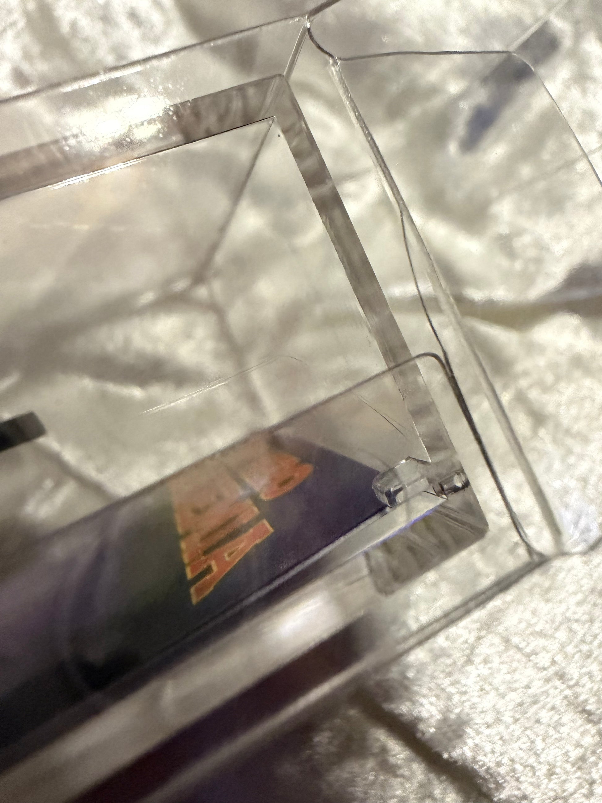 Close-up of crack on the flap of the display box for Shoto Todoroki Halloween FiGPiN #594 (Orphanage Collection)