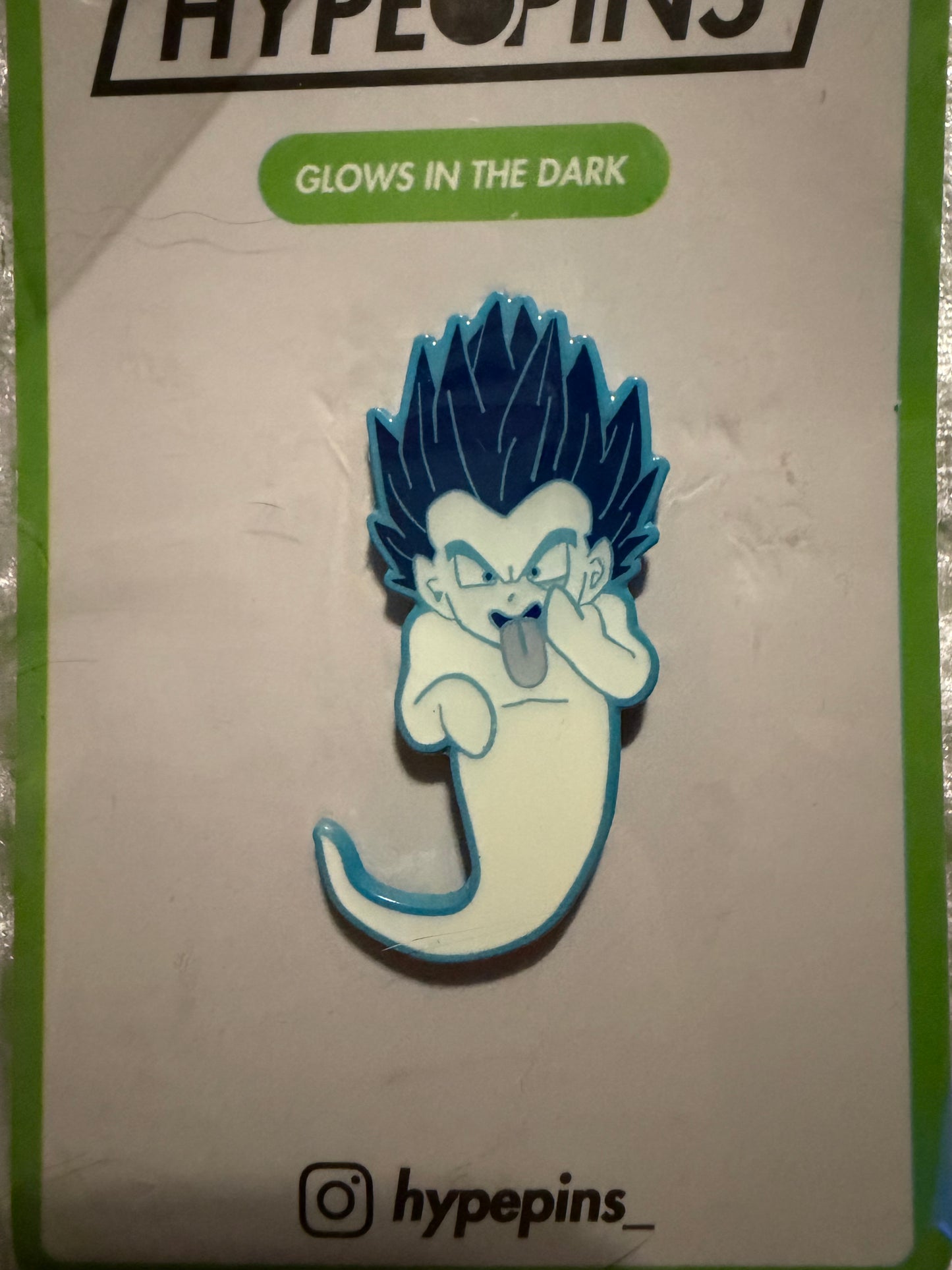 Close-up of the **Gotenks Ghost Bomb Hard Enamel Pin**, highlighting its blue dye soft enamel, epoxy coat, and **glow-in-the-dark** features. A detailed Dragon Ball Z collectible by Hype Pins.