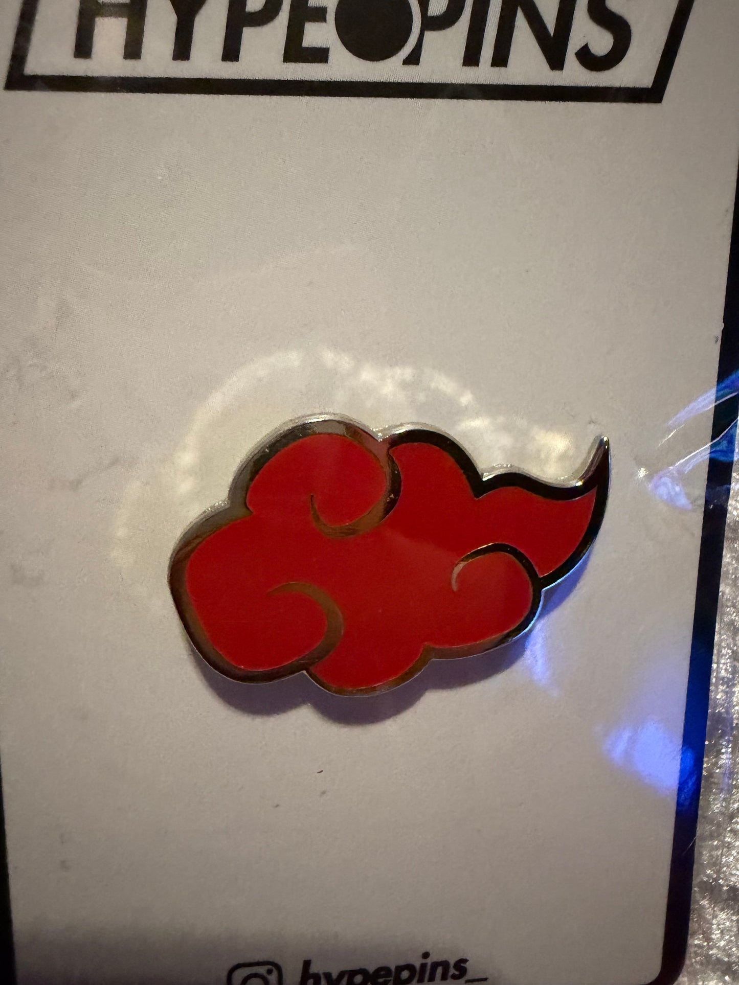 Close-up of the **Nimbus Cloud Black & Red Hard Enamel Pin**, highlighting its sleek design, vibrant black and red colors, and hard enamel finish. A detailed Dragon Ball Z collectible.