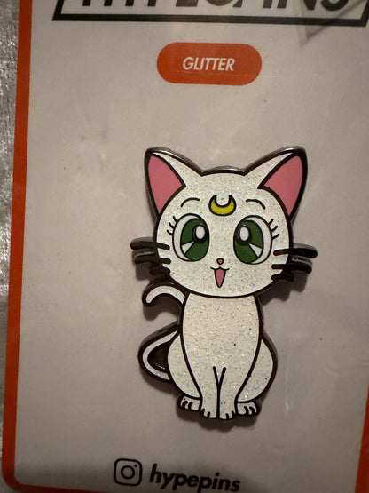 Close-up of the **Sailor Moon Cat Artemis Hard Enamel Pin**, showcasing its loyal expression, crisp hard enamel finish, and black nickel metal outline. A detailed anime collectible by Hype Pins.