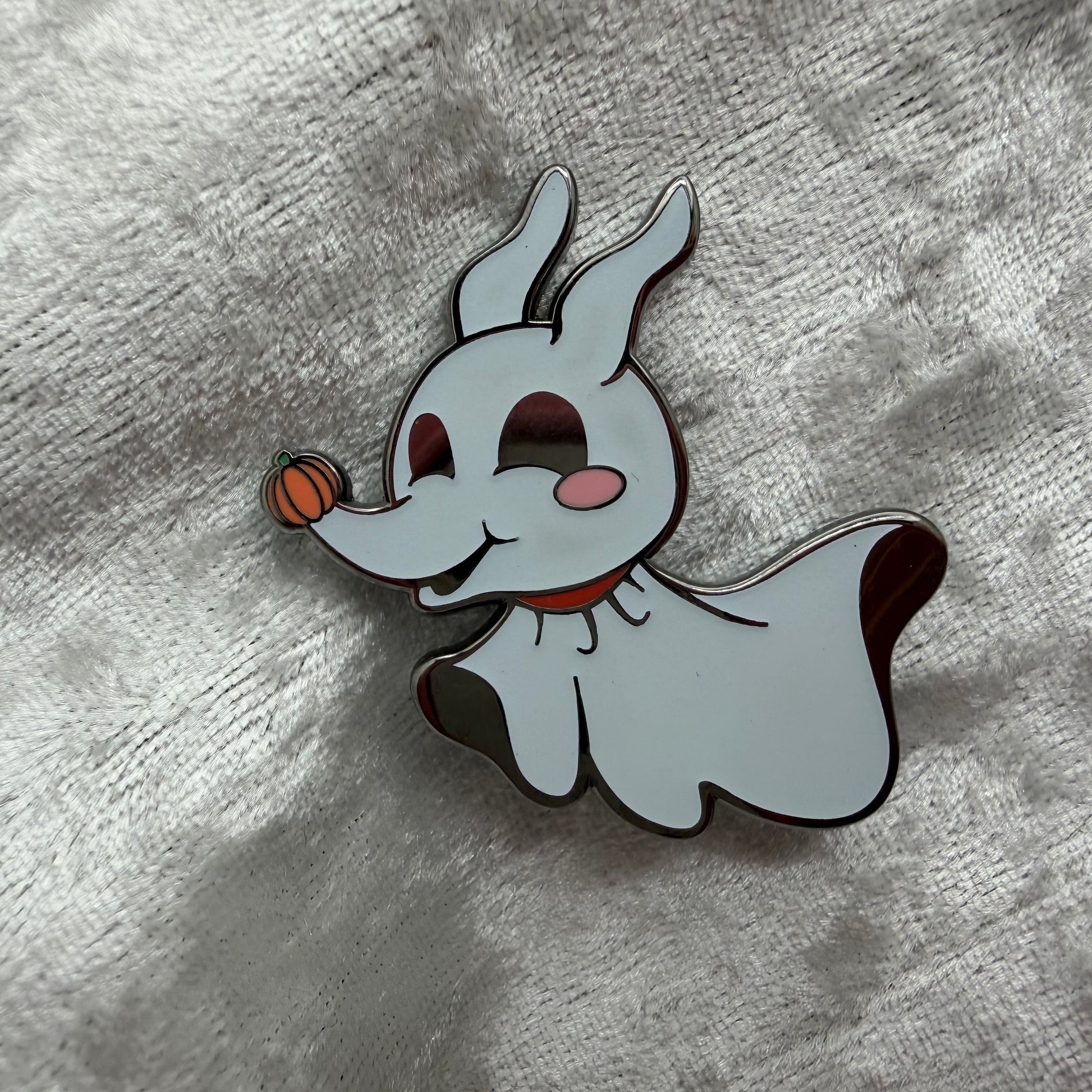Cute glow in the dark ghost dog enamel pin designed by Unicorn Crafts.