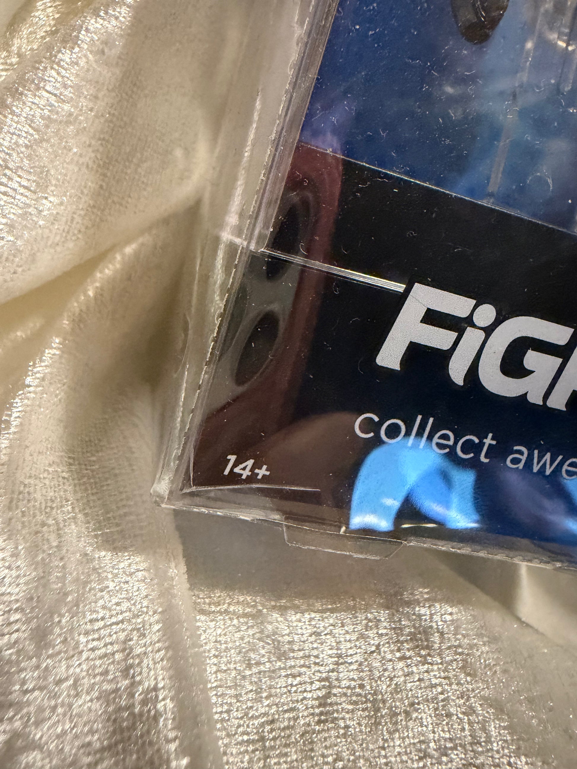 Damaged X-Men Animated Series Wolverine FiGPiN #2133, showing cracked plastic display case and detailed enamel pin.