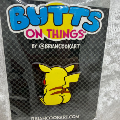 Electric Rat Butt Pin by Brian Cook funny yellow pocket monster parody enamel pin on backing card