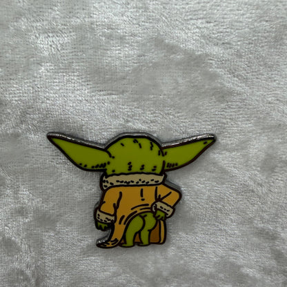 Funny baby green alien butt parody enamel pin by artist Brian Cook from Hatcher's Collectibles