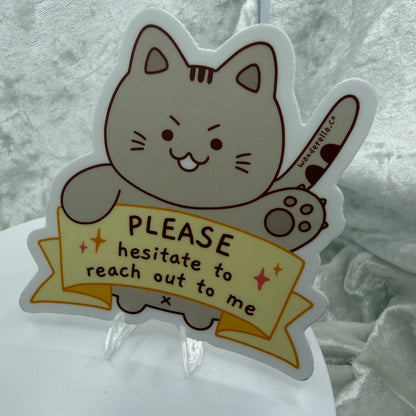 Funny cat sticker saying Please Hesitate to Reach Out
