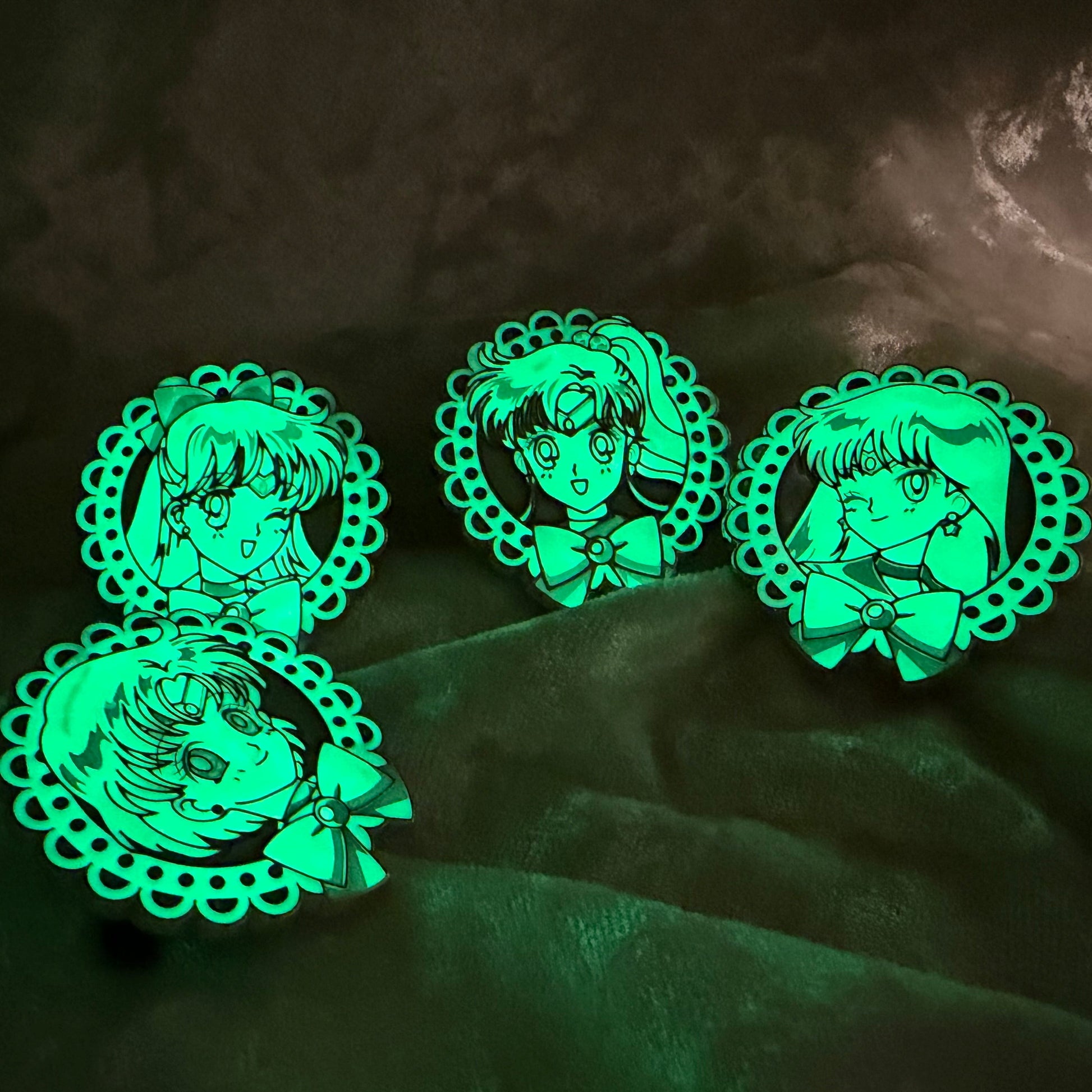 Glow in the dark uncommon FiGPiN Mystery Mini Sailor Moon Series 2 set featuring Venus Mars Jupiter and Mercury Glowing