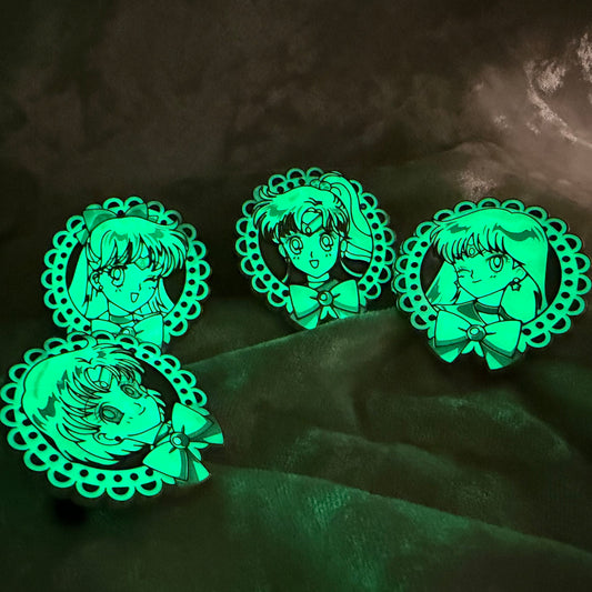 Glow in the dark uncommon FiGPiN Mystery Mini Sailor Moon Series 2 set featuring Venus Mars Jupiter and Mercury Glowing