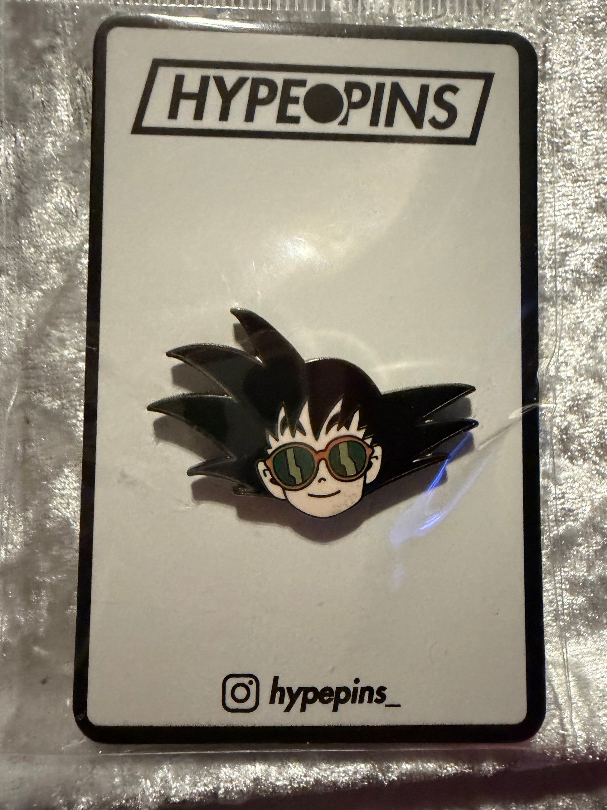 Goku Chillin Hard Enamel Pin by Hype Pins, a casual Dragon Ball Z collectible with epoxy finish, ready for display.