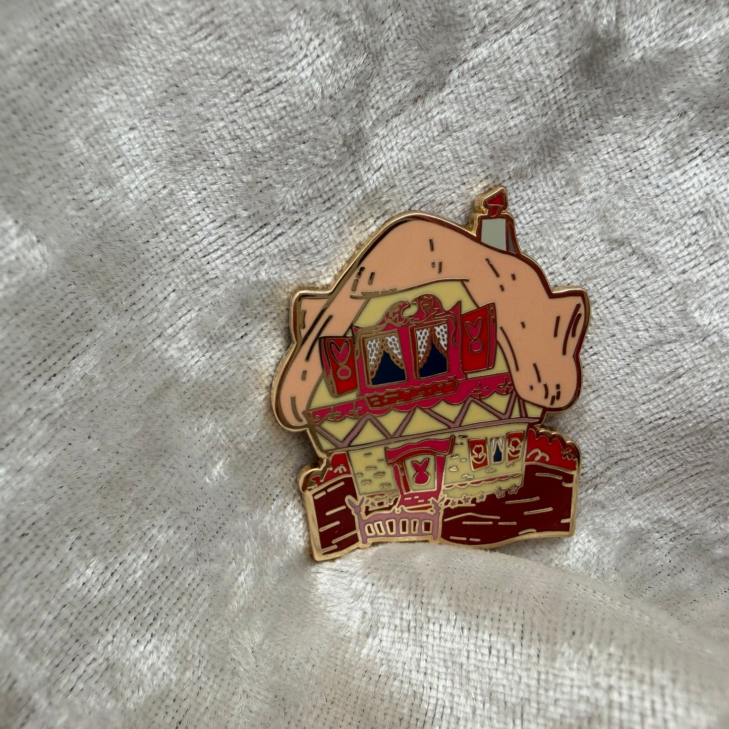 Mary Blair style White Rabbit house enamel pin designed by Unicorn Crafts.