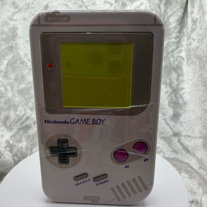 Retro Nintendo Game Boy metal candy tin with D-pad shaped grape candies
