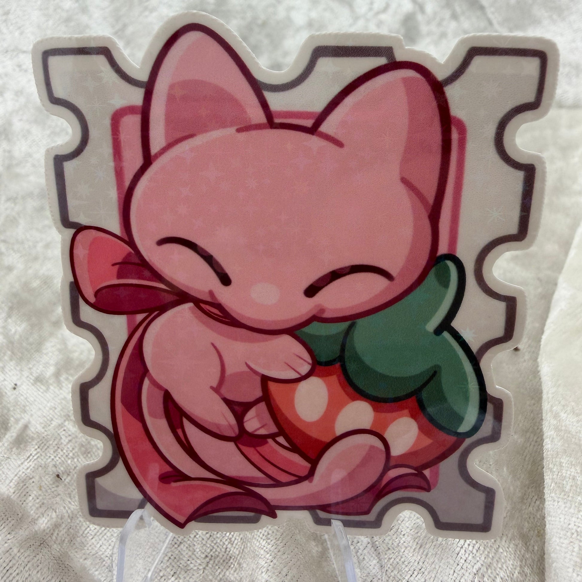 Star holographic cat poke stamp vinyl sticker on a notebook