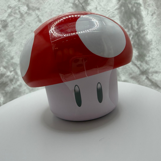 Super Mario Bros red mushroom tin filled with sour cherry candies