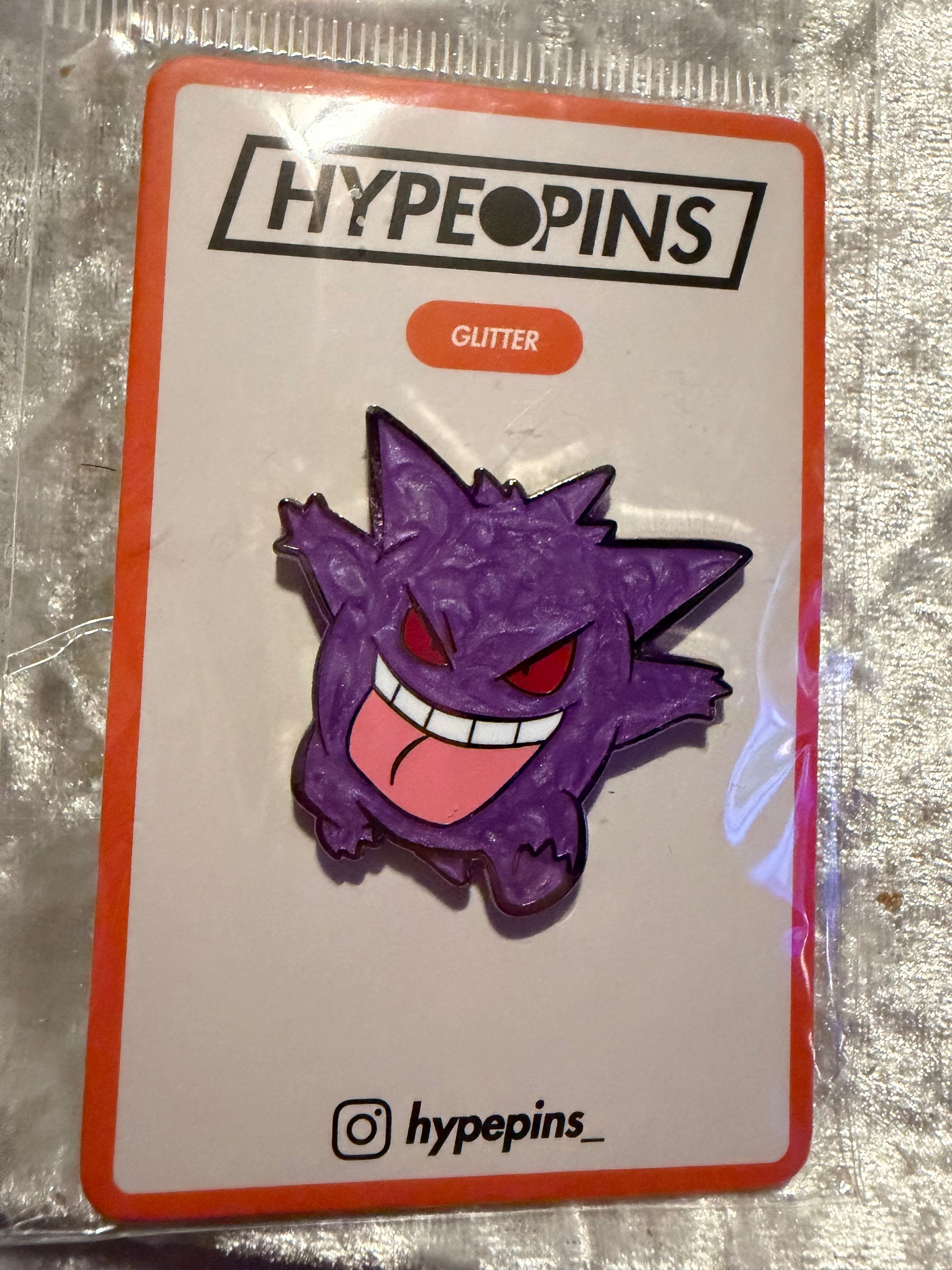 The **Gengar Hard Enamel Pin**, a vibrant **Pokémon Ghost Type collectible** by Hype Pins, featuring **pearl accents** and a secure butterfly clutch backing.