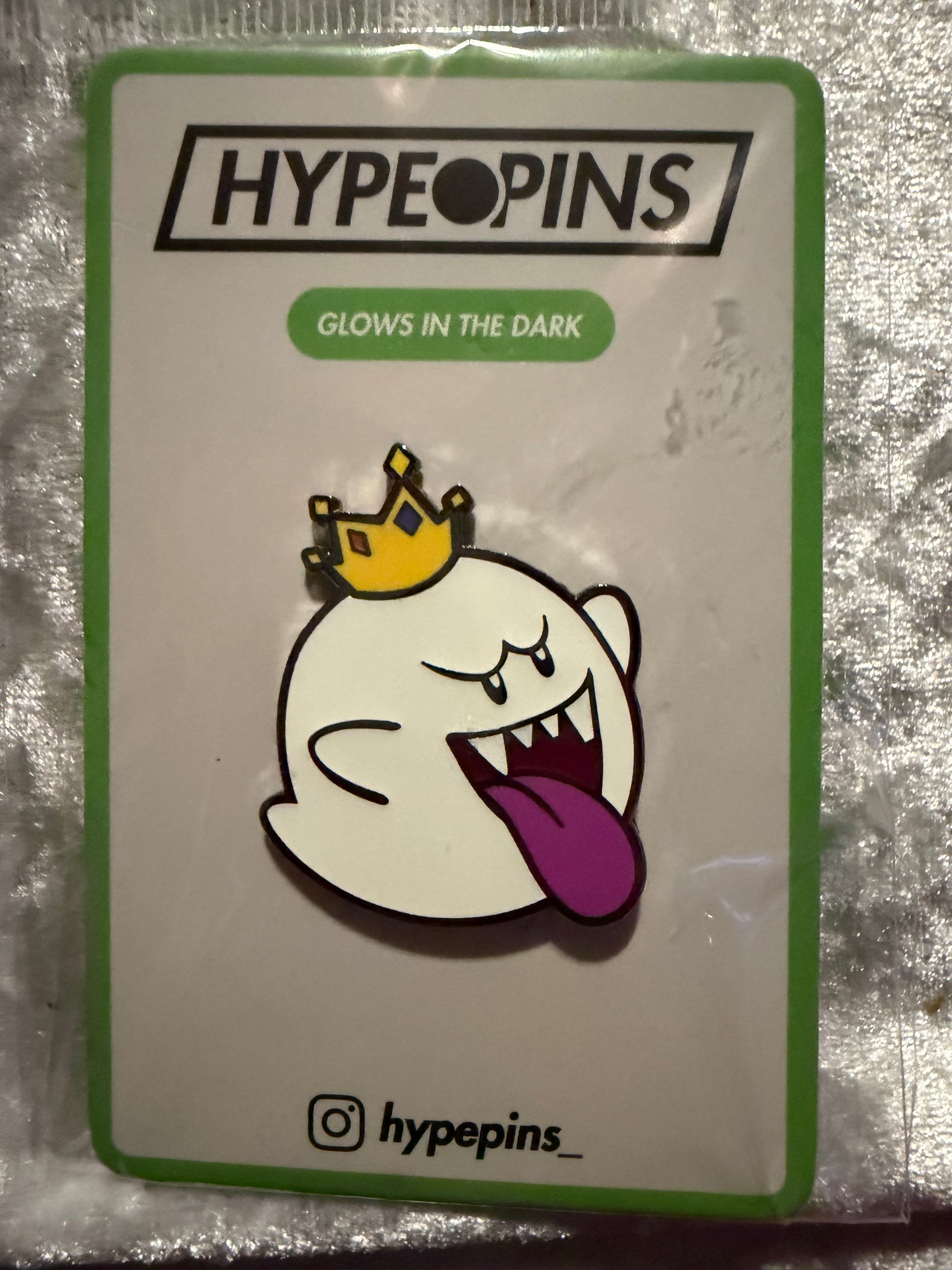 The **King Boo Glow In The Dark Hard Enamel Pin**, a vibrant Super Mario Bros. collectible by Hype Pins, showcasing its ghostly charm and **unique glow feature**.