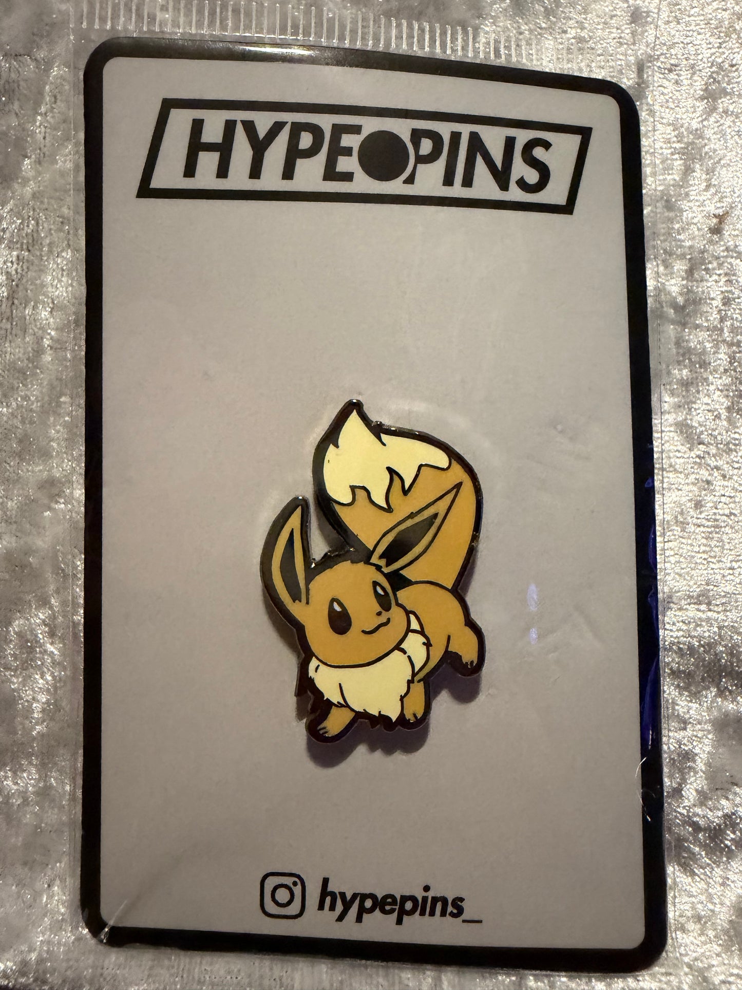 The **Pokémon Eevee Hard Enamel Pin**, a charming **Eevee collector's pin** by Hype Pins, perfect for any fan of the iconic Pokémon.