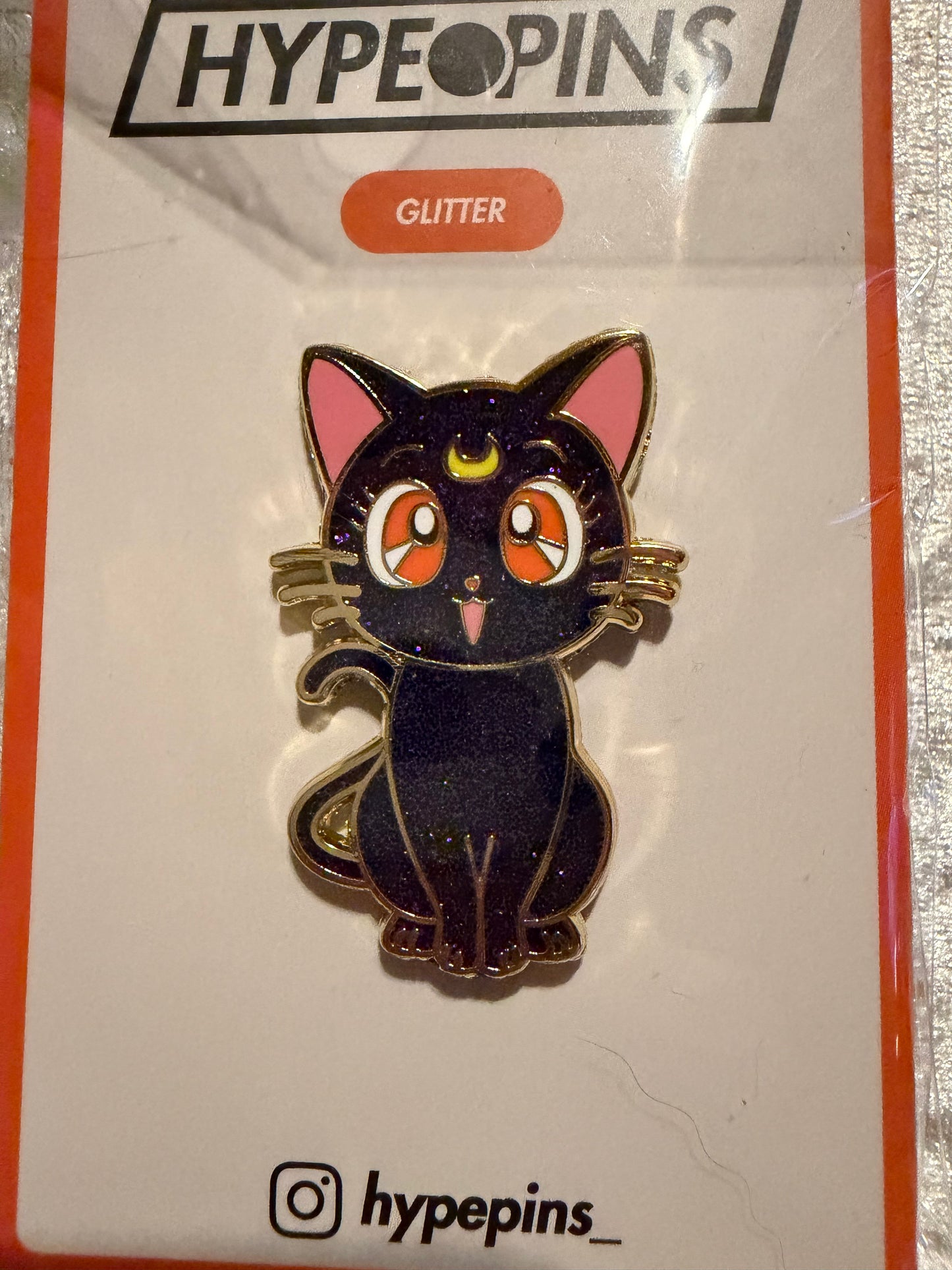 The **Sailor Moon Cat Luna Hard Enamel Pin**, a vibrant **gold-plated Sailor Moon collectible** by Hype Pins, featuring the wise guardian cat Luna in a classic pose.